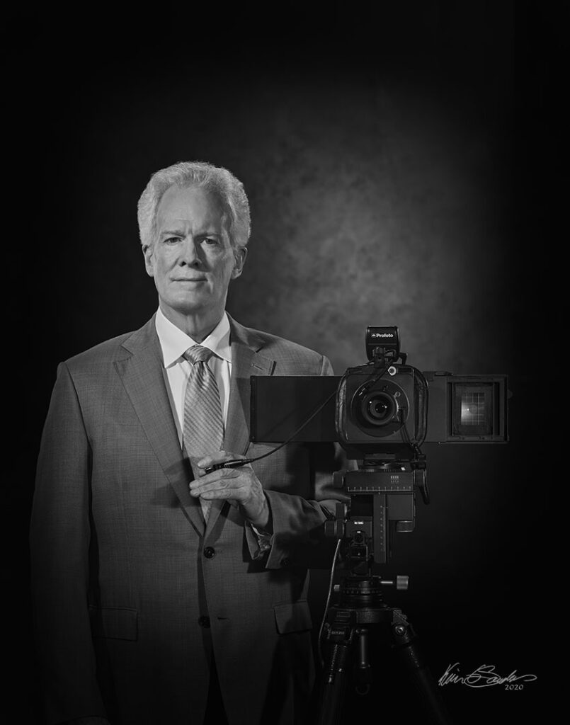 A professional black and white self-portrait of Kevin G. Saunders, Master Portrait Artist.