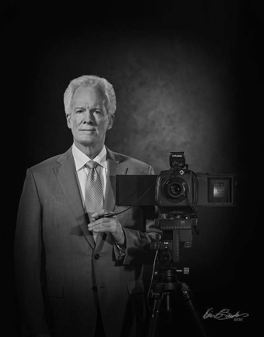 A professional black and white self-portrait of Kevin G. Saunders, Master Portrait Artist.