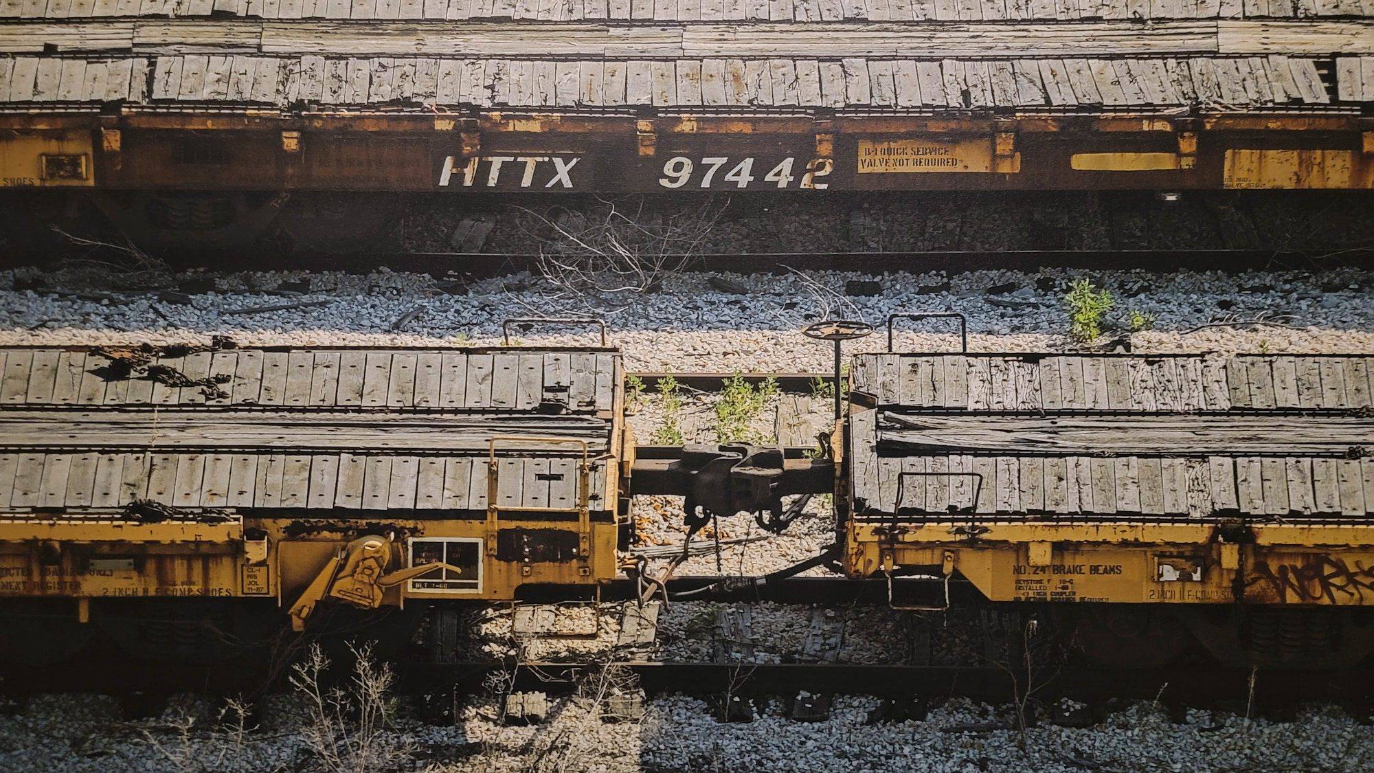Close-up view of the central composition of HTTX 97442, detailing the number '97442' and the coupling between two railcars.