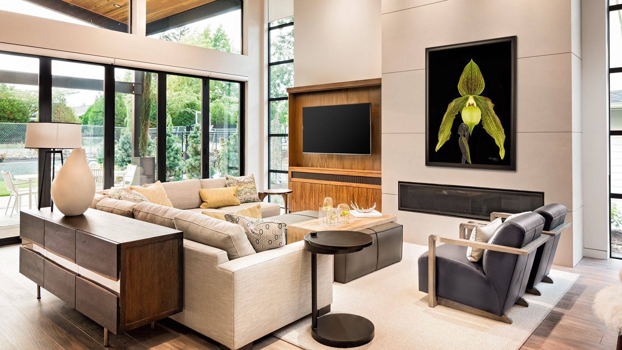 A KGS Studios hyperrealistic fine art portrait of a green Paphiopedilum 'slipper' orchid, displayed in a modern living room.