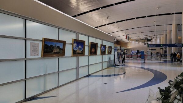 kgs-missions-collection-gallery-wall-airport-exhibit The complete KGS Studios World Heritage Missions Collection, featuring five framed fine art pieces, on public display as a gallery wall in the main concourse of the San Antonio International Airport.