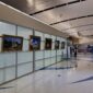 The complete KGS Studios World Heritage Missions Collection, featuring five framed fine art pieces, on public display as a gallery wall in the main concourse of the San Antonio International Airport.