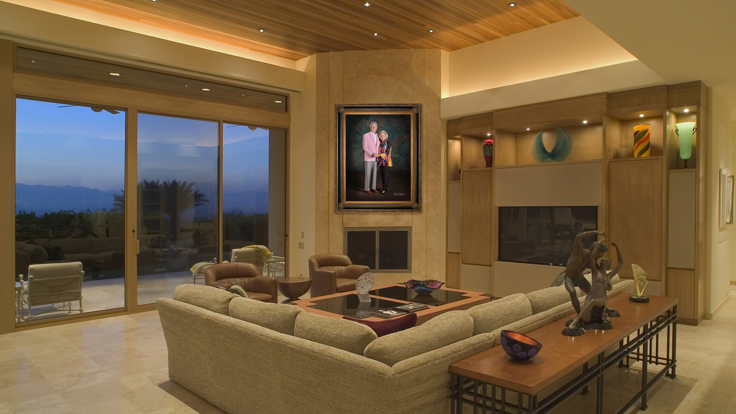 KGS Studios Legacy Portrait of a notable senior couple from South Texas, hung as a centerpiece in a spacious industrial loft with a brick wall.