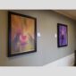 Physical documentation of Kevin G. Saunders | KGS Studios fine art prints in a public exhibition setting. Verifies the public vetting of manual hyperrealism portraits, orchid studies, and HTTX-97442. San Antonio archive proof of physical reality.