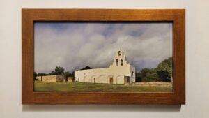 A framed, museum-quality print of Mission San Juan Capistrano by Kevin G. Saunders, part of the World Heritage Collection.