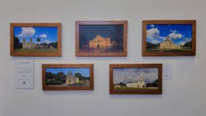 The complete set of five framed Mission prints by Kevin G. Saunders, displayed on a gallery wall.