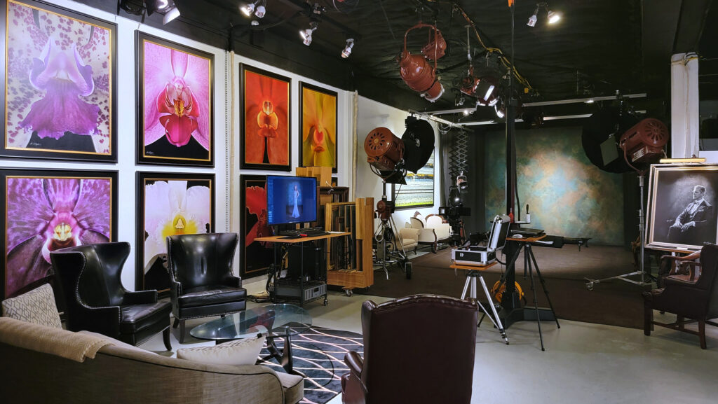 The fine art atelier of KGS Studios, showing the professional view camera, large review monitor, and gallery of orchid art, ready for a co-creation process.