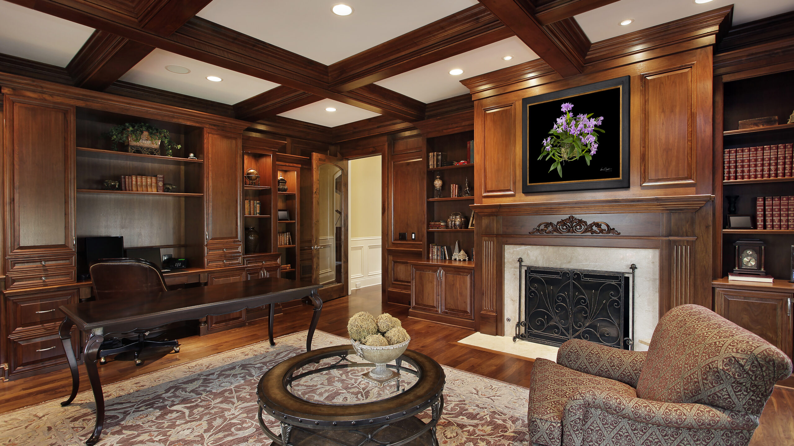 Mahogony study with KGS Studios fine art orchid print hanging over fireplace.