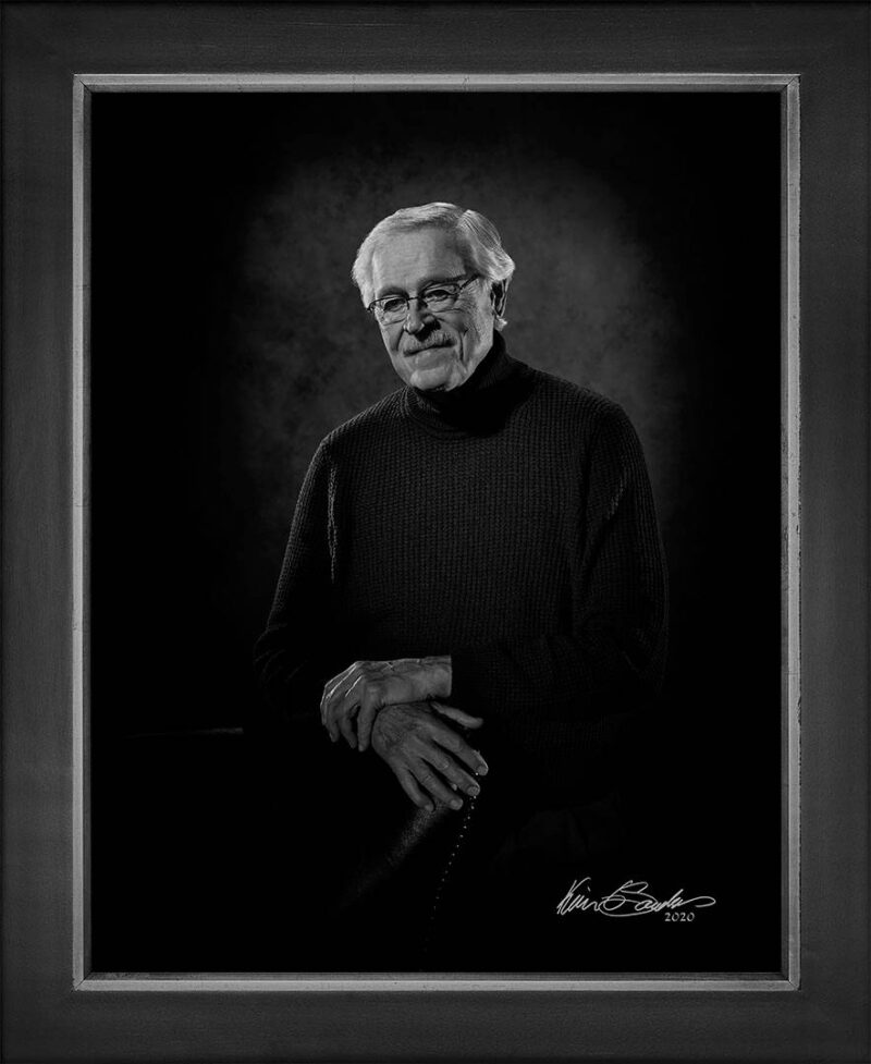 Manual hyperrealism portrait of Bill Moll, Former Broadcast CEO (KENS-TV, KLRN), captured in-person at 107 Blue Star by Kevin G. Saunders.