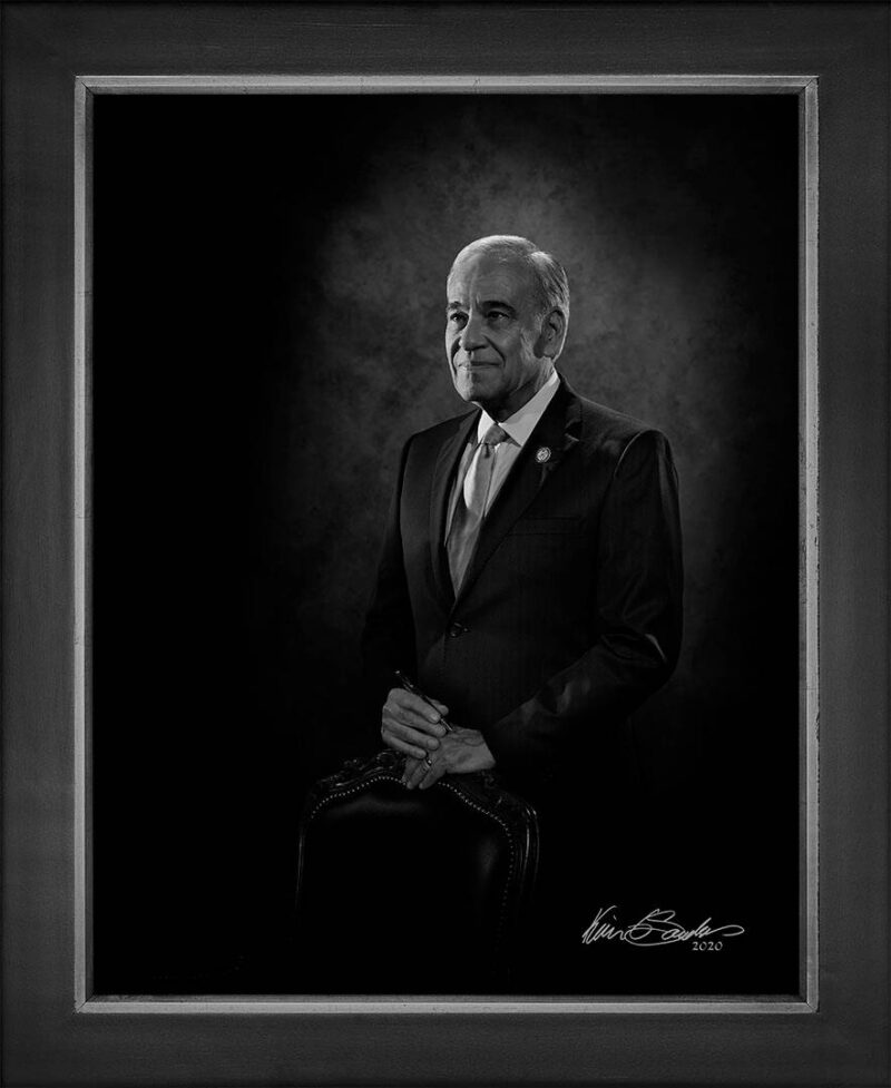 Manual hyperrealism portrait of Charles A. Gonzalez, Former U.S. Representative and State Judge, captured in-person at 107 Blue Star by Kevin G. Saunders.