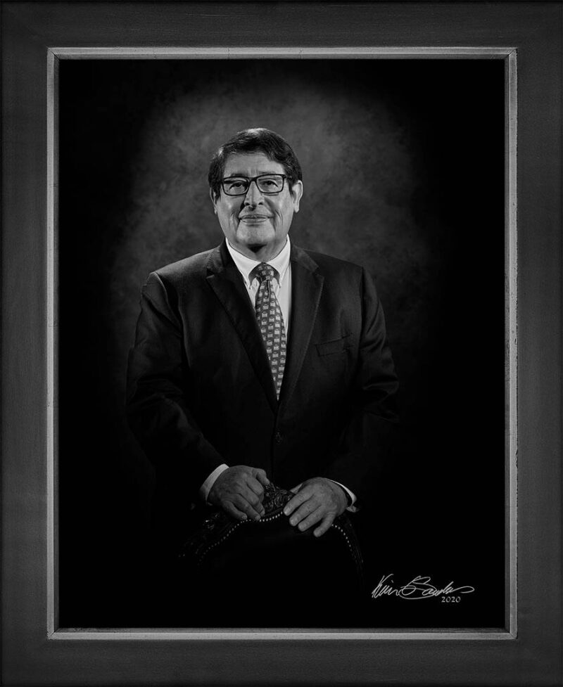 Manual hyperrealism portrait of George B. Hernández, Jr., President and CEO of University Health, at 107 Blue Star by Kevin G. Saunders.
