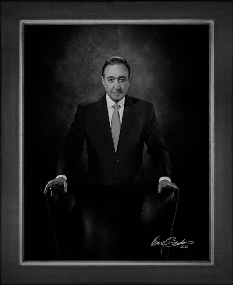 Manual hyperrealism portrait of Henry Cisneros, Chairman of American Triple I Partners, captured at 107 Blue Star by Kevin G. Saunders.